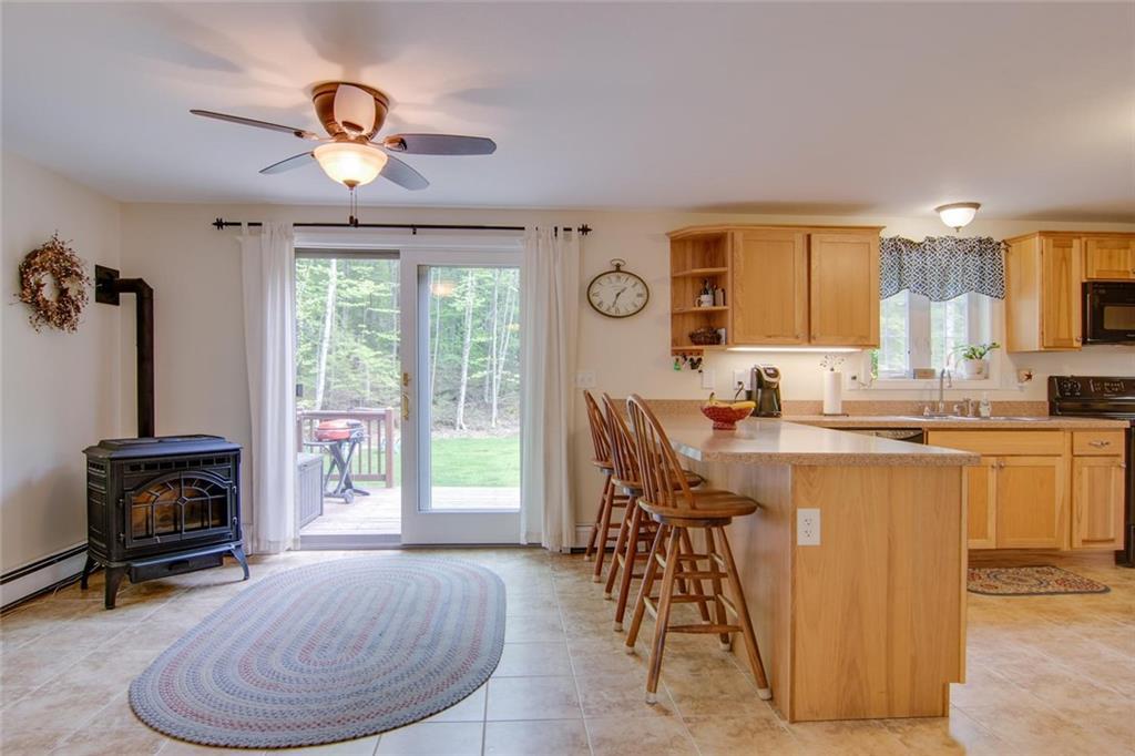 11 Molly Lane Sebago, ME 04029 - Photo 7 of 22 Kitchen/dining area and slider to deck.