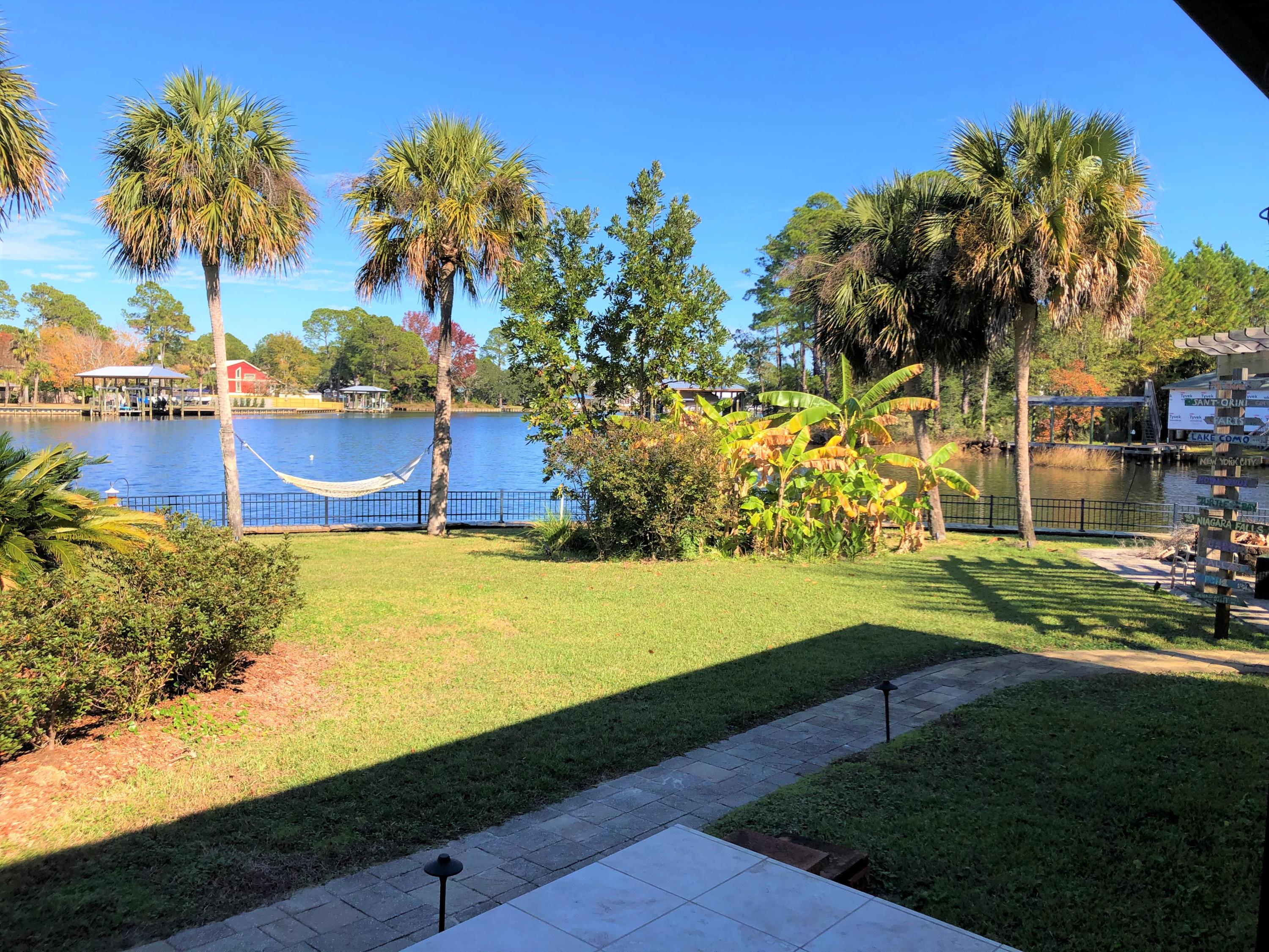 300 West Harborview Road Santa Rosa Beach, FL 32459 - Photo 14 of 48 a view of a yard with an outdoor space