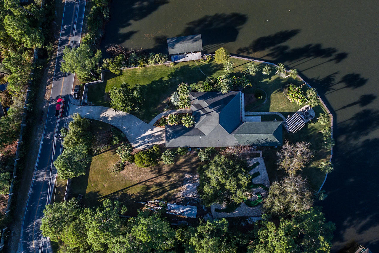 300 West Harborview Road Santa Rosa Beach, FL 32459 - Photo 3 of 48 an aerial view of a house with a yard