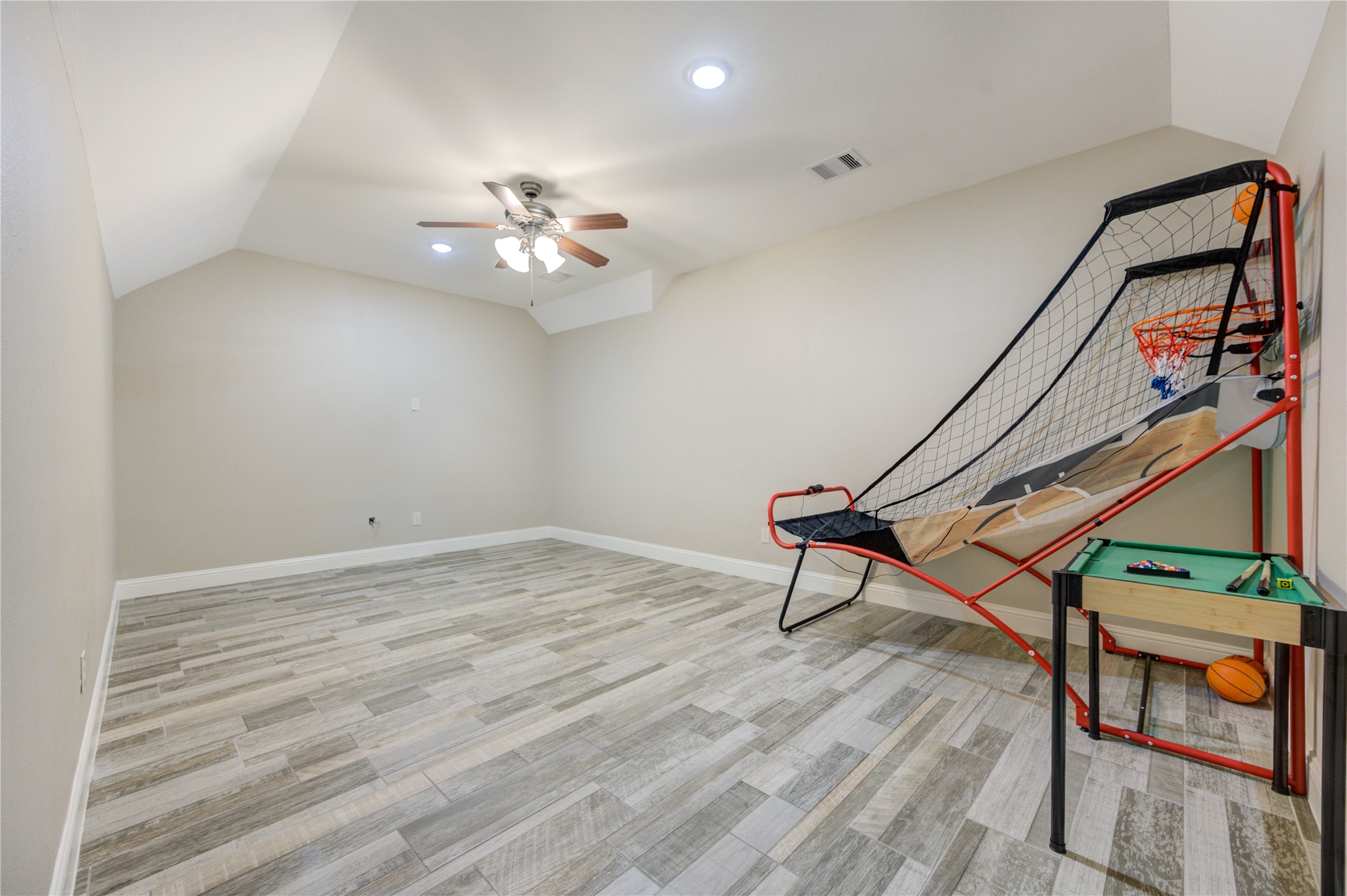 21038 Angus Drive Cleveland, TX 77328 - Photo 32 of 49 a view of an empty room with furniture wooden floor and a window
