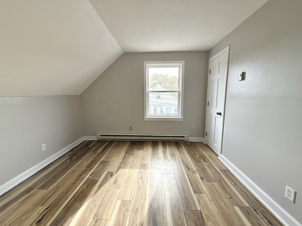 13 Brooks Avenue, Unit 2 Quincy, MA 02169 - Photo 12 of 15 a view of a room with wooden floor and window