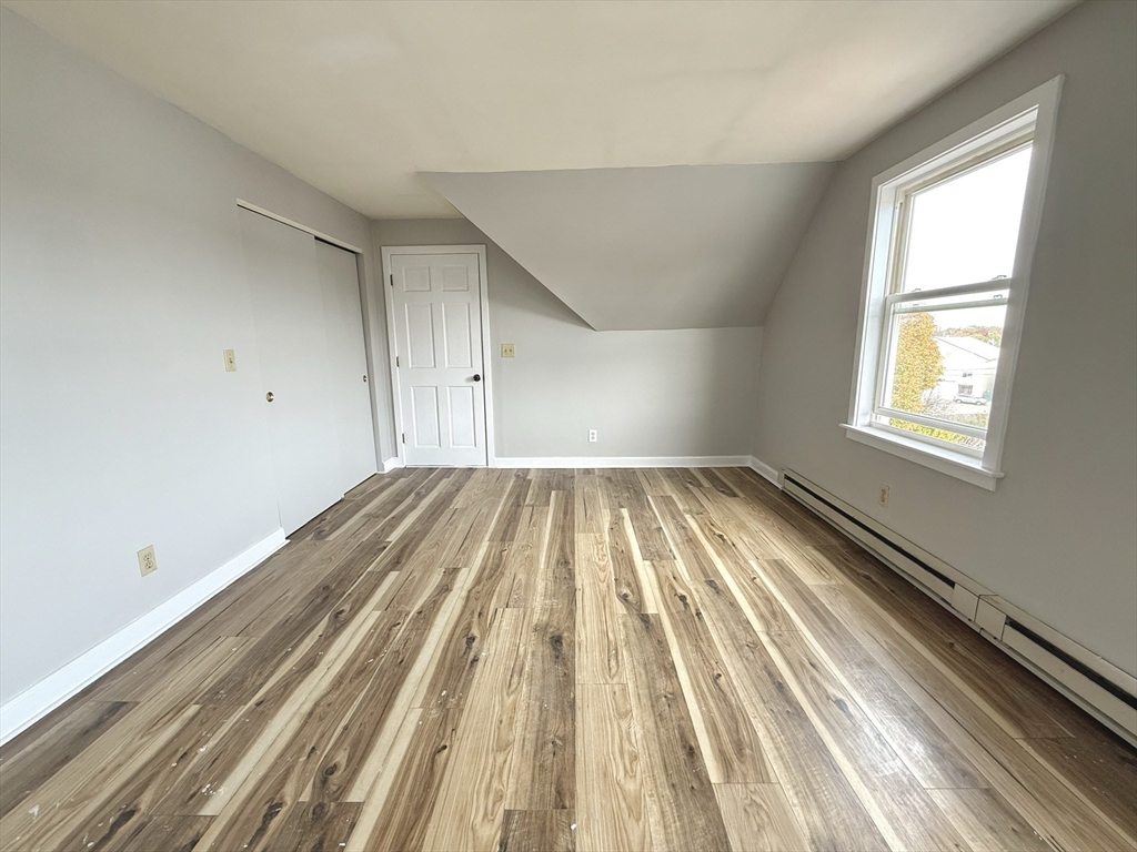 13 Brooks Avenue, Unit 2 Quincy, MA 02169 - Photo 14 of 15 a view of a room with wooden floor and window