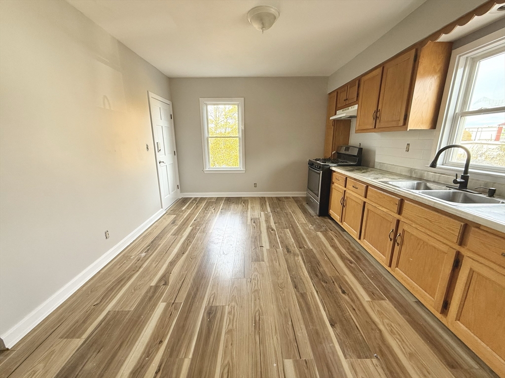 13 Brooks Avenue, Unit 2 Quincy, MA 02169 - Photo 6 of 15 a view of a kitchen from the main door