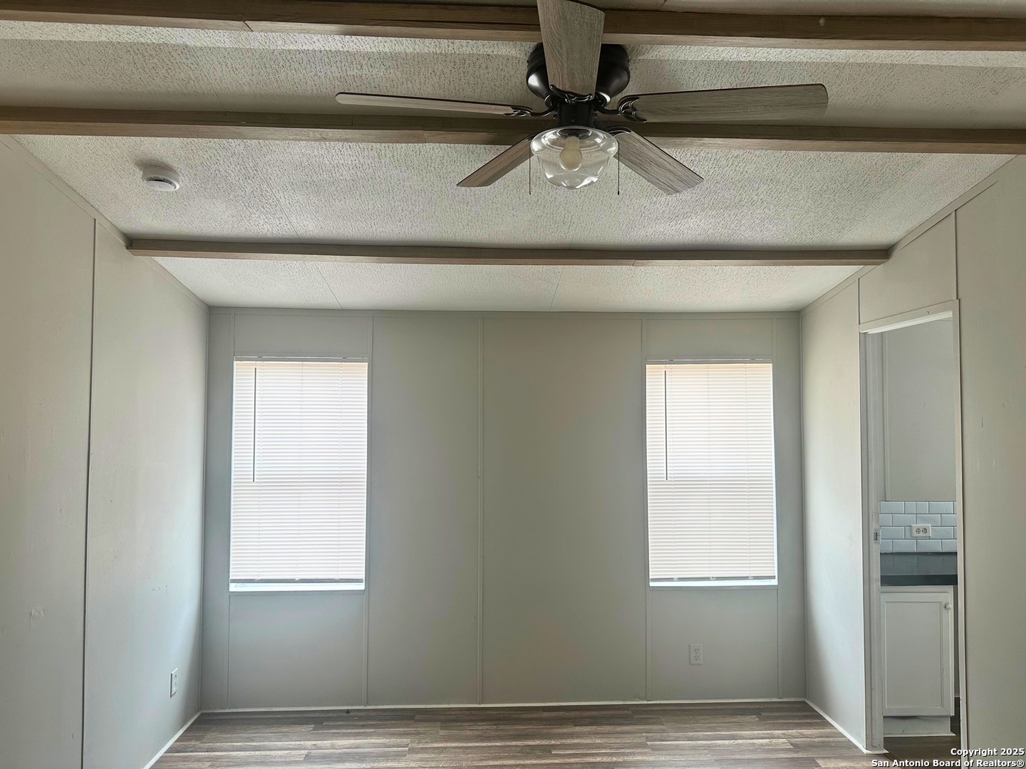 310 Duck Street Pleasanton, TX 78064 - Photo 6 of 6 a view of an empty room and window