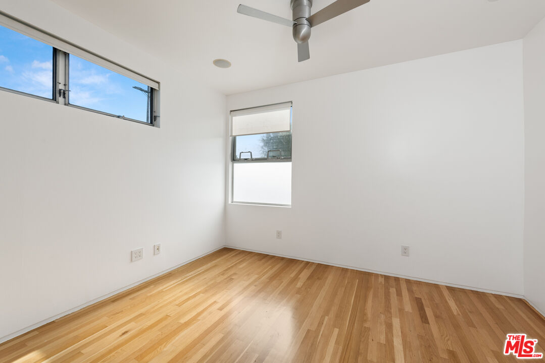 705 Sunset Avenue, Unit FRONT Venice, CA 90291 - Photo 11 of 17 a view of a room with wooden floor and window