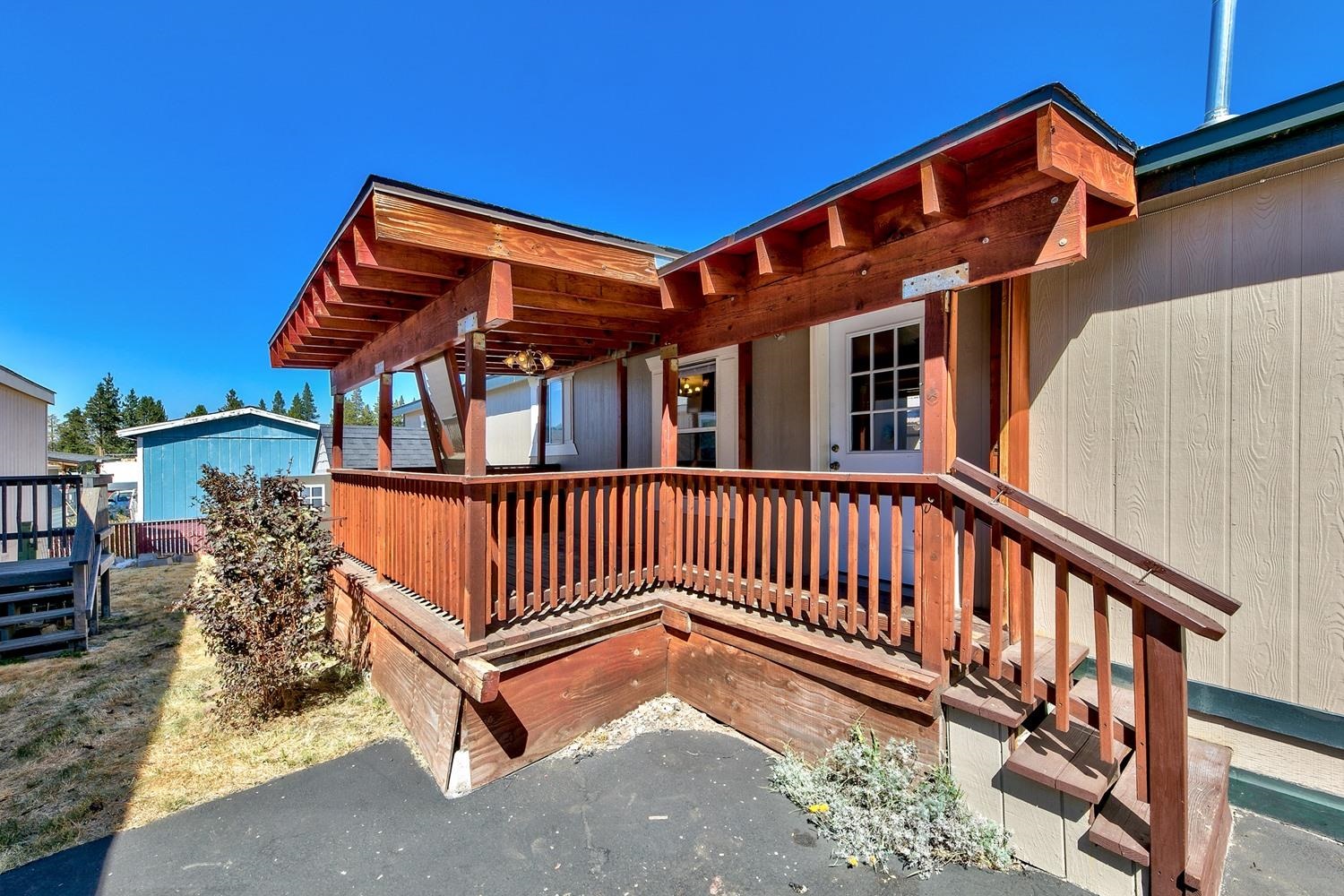 11070 Brockway Road, Unit 70 Truckee, CA 96161 - Photo 3 of 16 a view of a house with a wooden fence