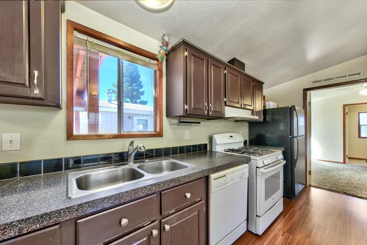 11070 Brockway Road, Unit 70 Truckee, CA 96161 - Photo 9 of 16 a kitchen that has a sink a stove and cabinets