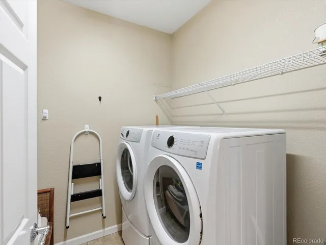 a view of yard with swimming pool and sitting area