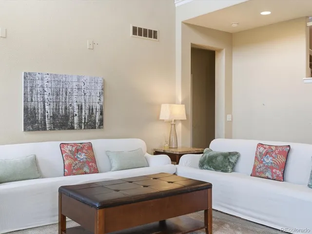 a dining room with furniture window and outside view