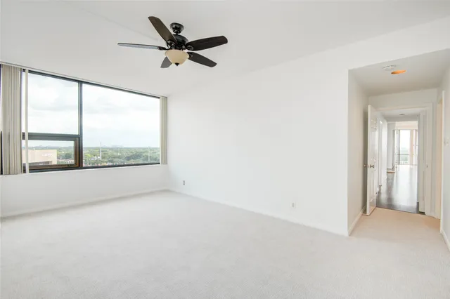 a view of a workspace with furniture and a flat screen tv