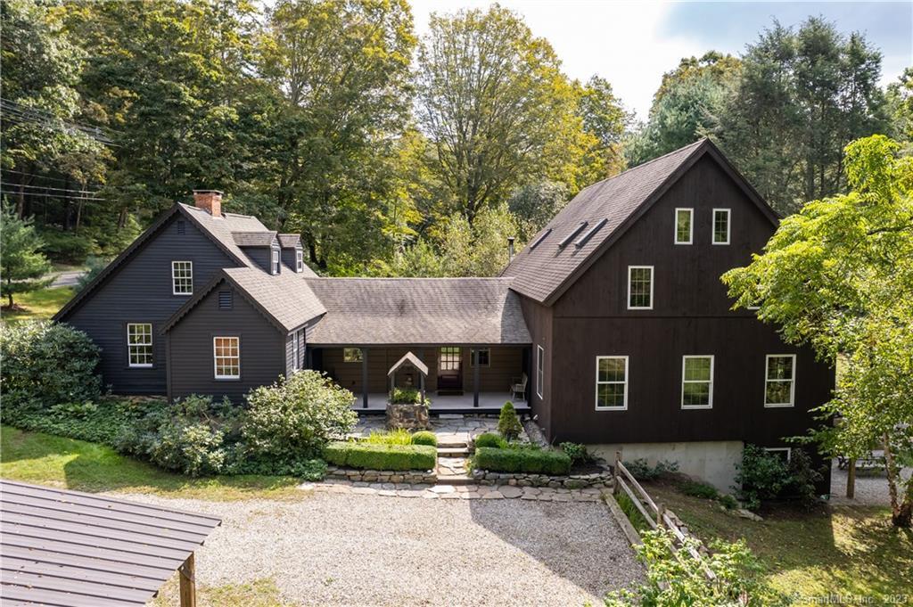 565 Horse Pond Road Madison, CT 06443 - Photo 1 of 1 a front view of a house with garden
