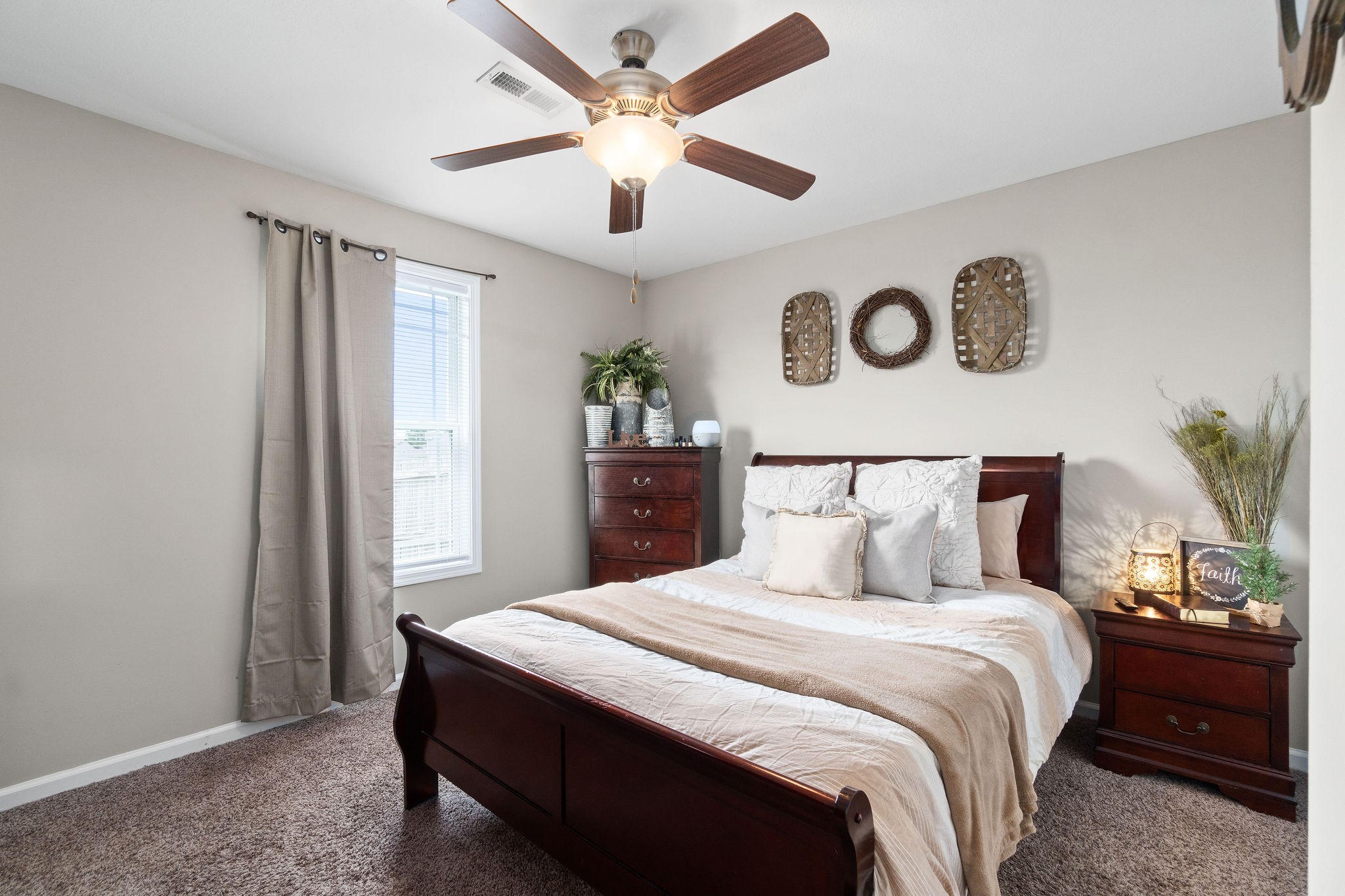 905 Hugh Hunter Road Oak Grove, KY 42262 - Photo 22 of 33 a bedroom with a large bed and a chandelier