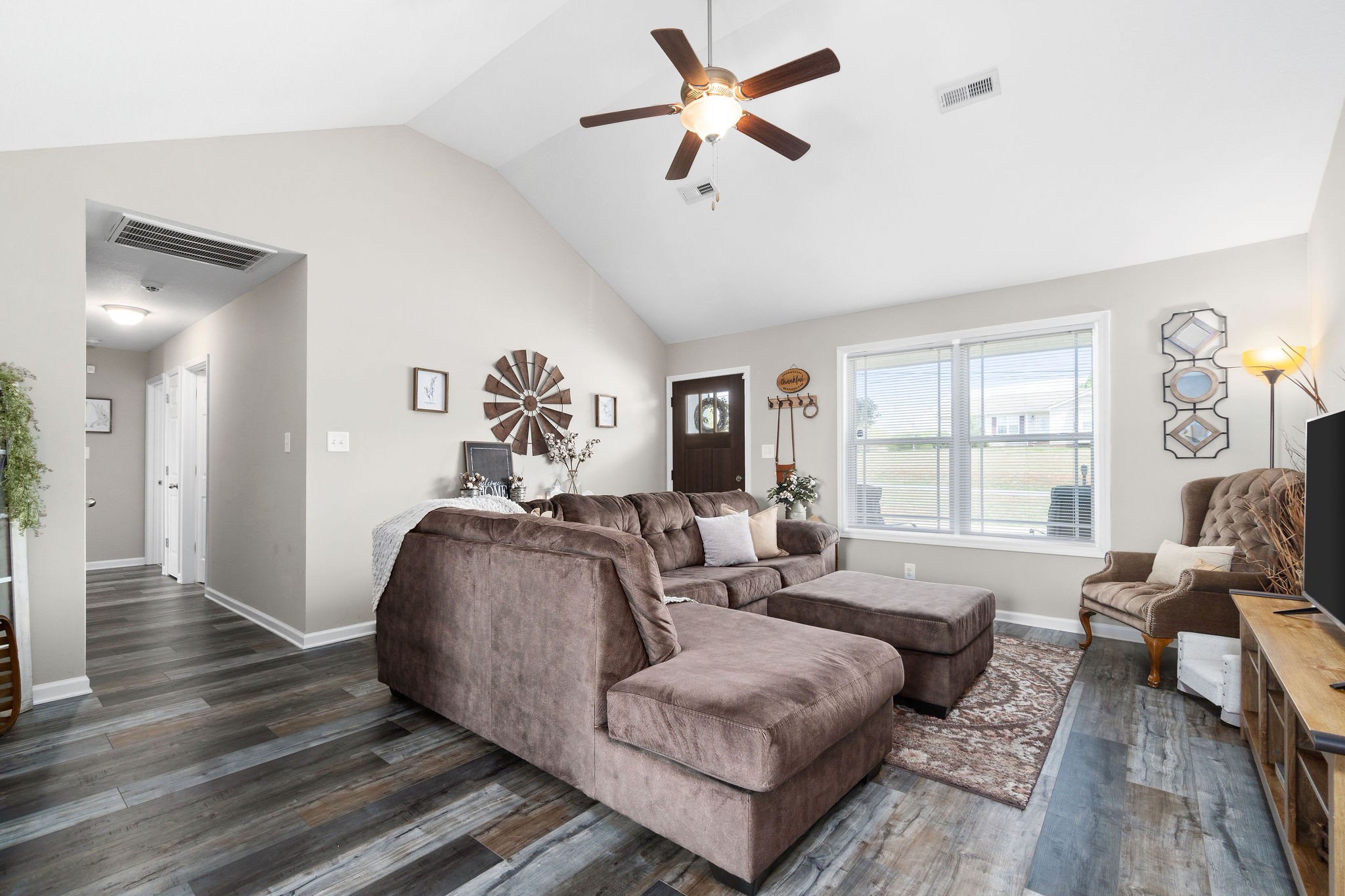 905 Hugh Hunter Road Oak Grove, KY 42262 - Photo 8 of 33 a spacious bedroom with a bed couch and a window