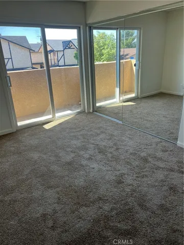 an empty room with a fireplace