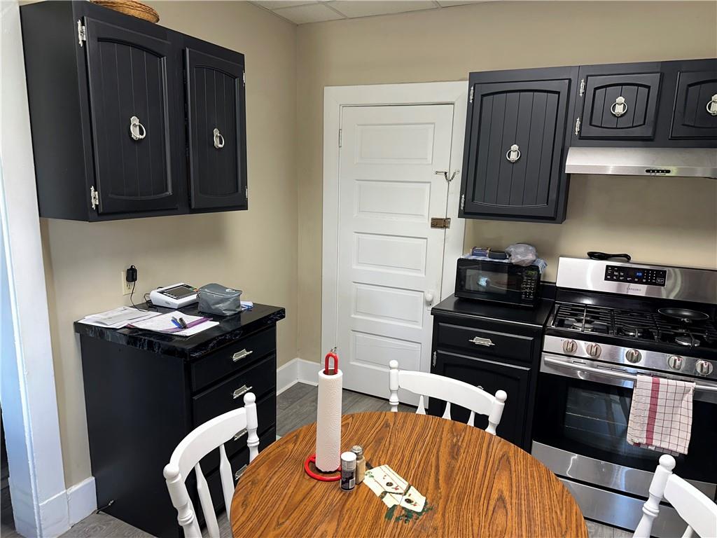 446 Virginia Avenue Rochester, PA 15074 - Photo 3 of 33 a kitchen with a stove and a refrigerator