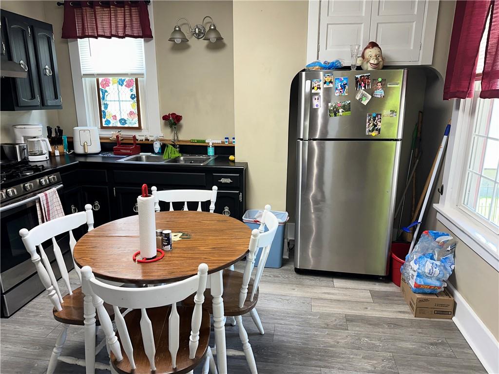 446 Virginia Avenue Rochester, PA 15074 - Photo 4 of 33 a dining table with chairs and window