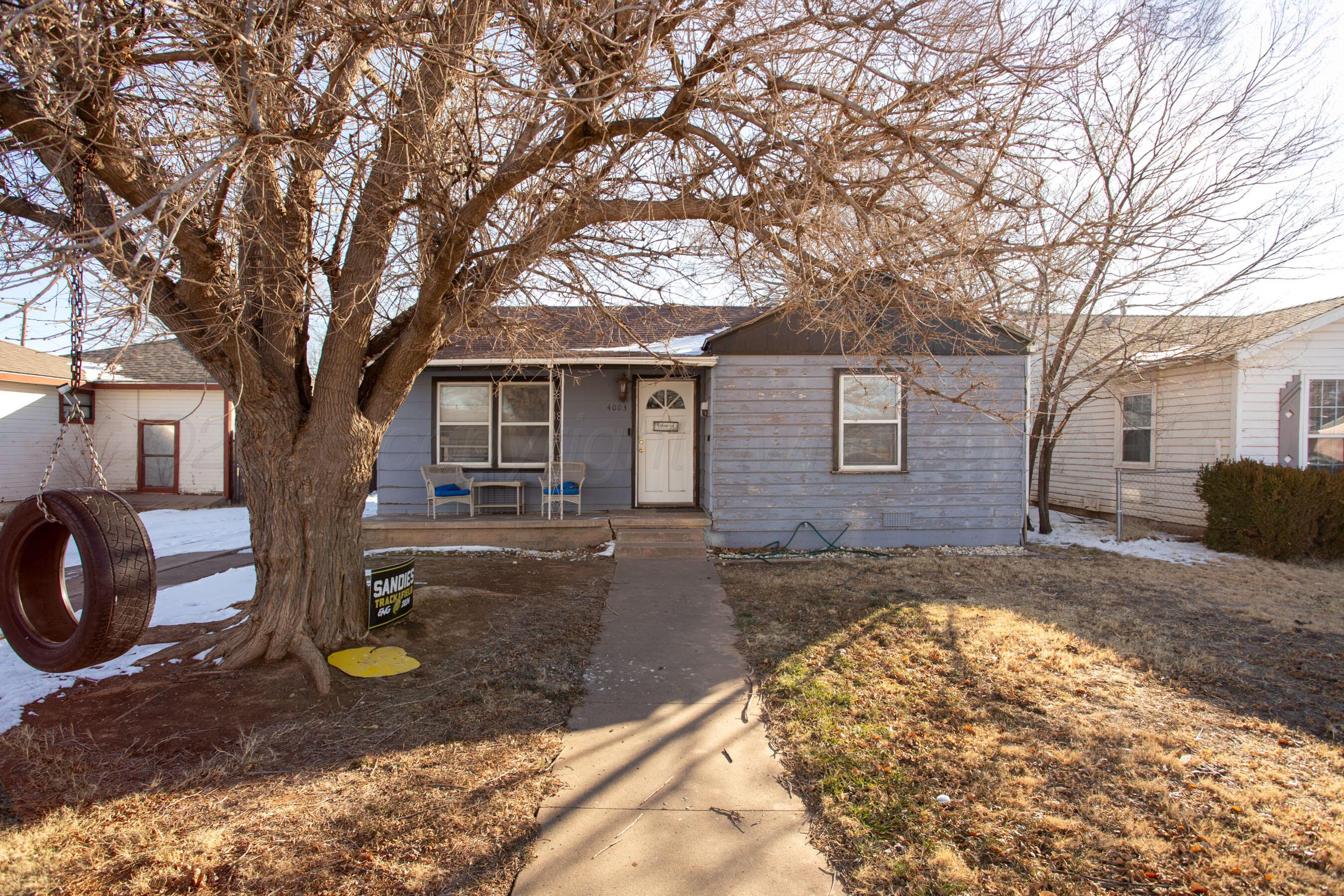 4003 South Van Buren Street Amarillo, TX 79110 - Photo 20 of 25 a view of a house with a yard