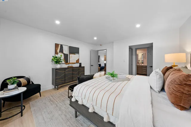 a bedroom with a bed and a dresser