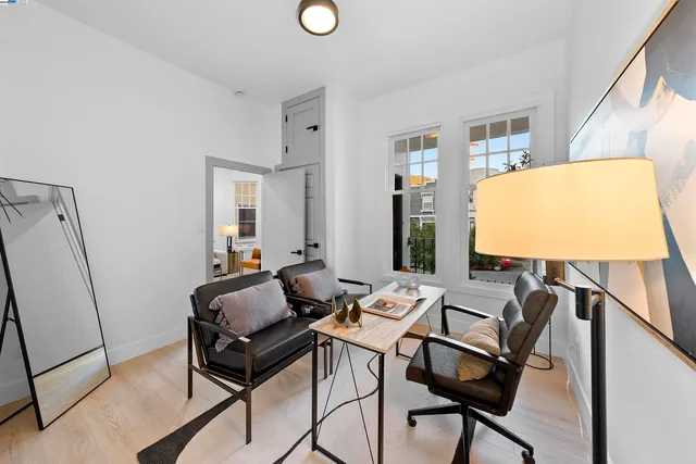 a view of a livingroom with furniture and a window