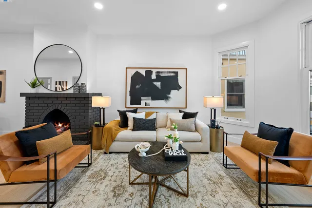 a living room with furniture and a fireplace