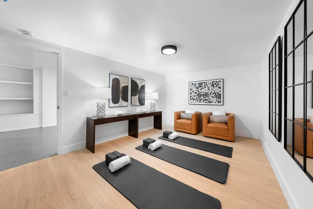 a bedroom with furniture and a lamp