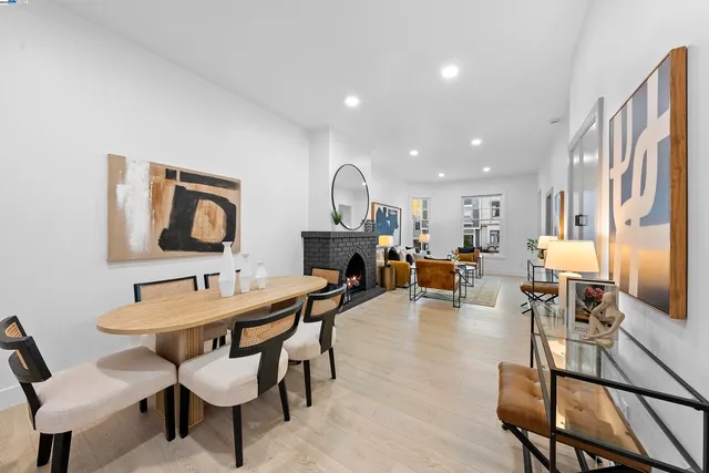 a view of a dining room with furniture and a chandelier