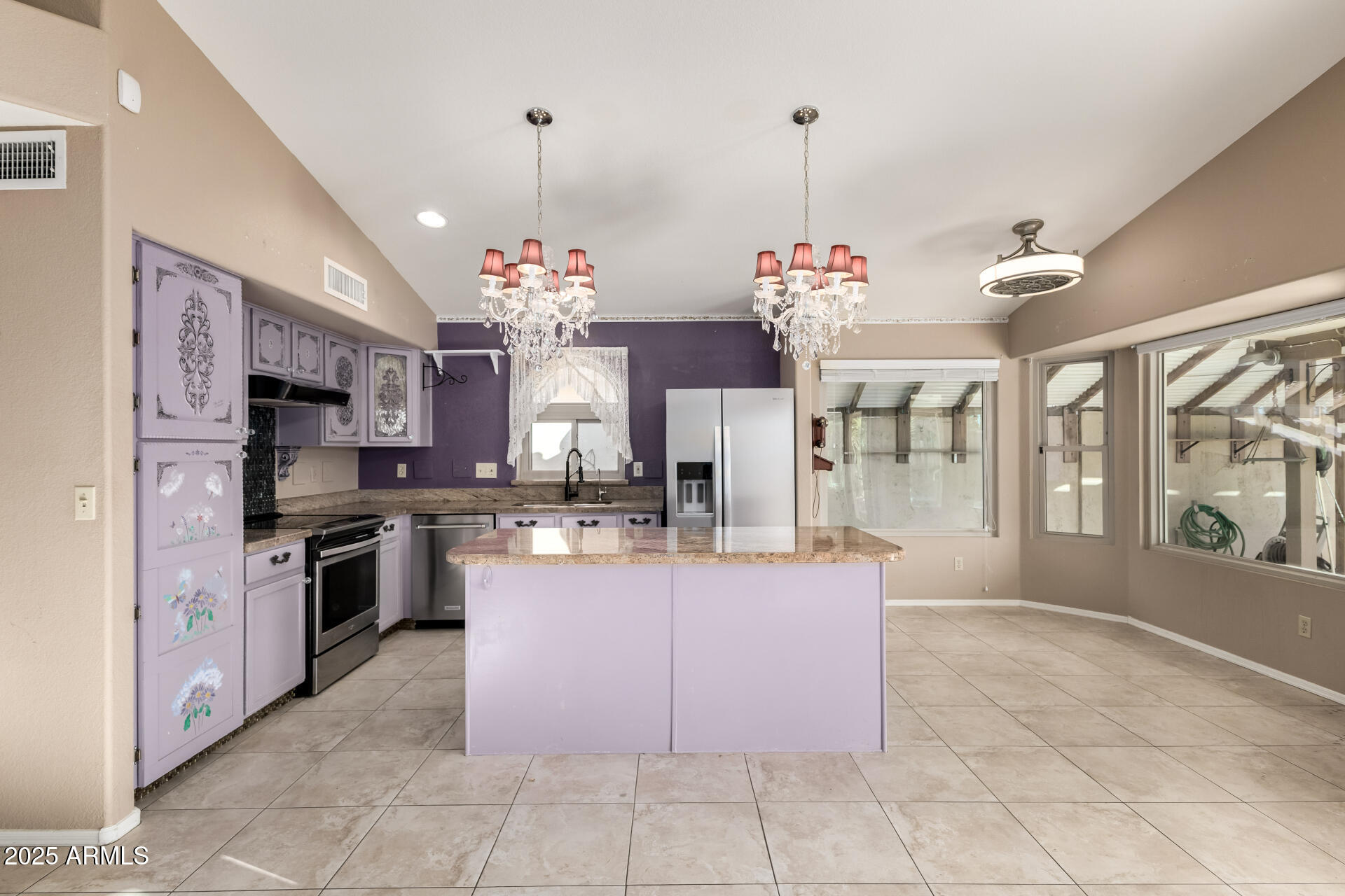 14841 South 46th Place Phoenix, AZ 85044 - Photo 14 of 43 a large kitchen with kitchen island granite countertop a stove a sink a counter top space and cabinets