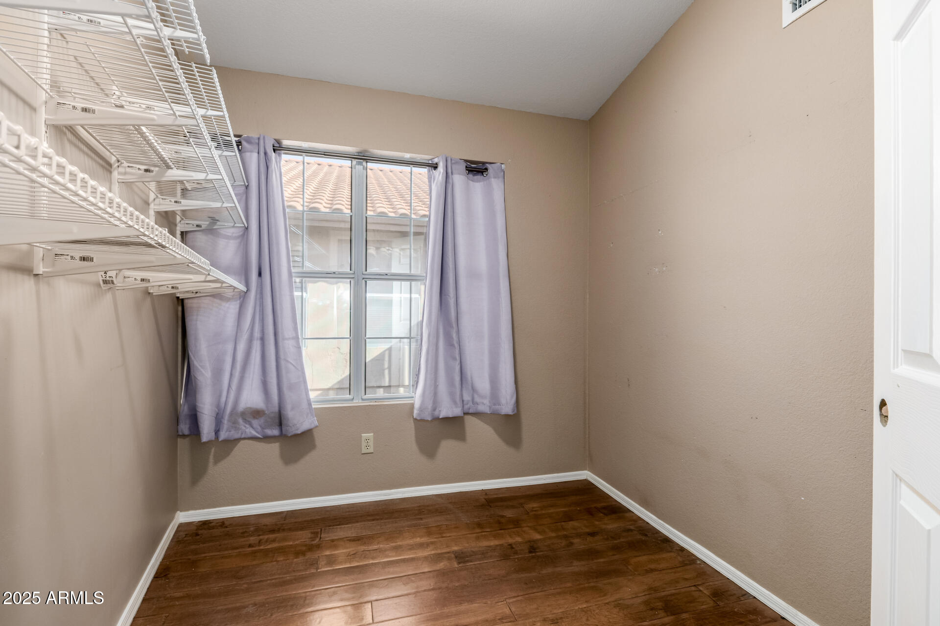 14841 South 46th Place Phoenix, AZ 85044 - Photo 20 of 43 a view of a room with wooden floor and a window
