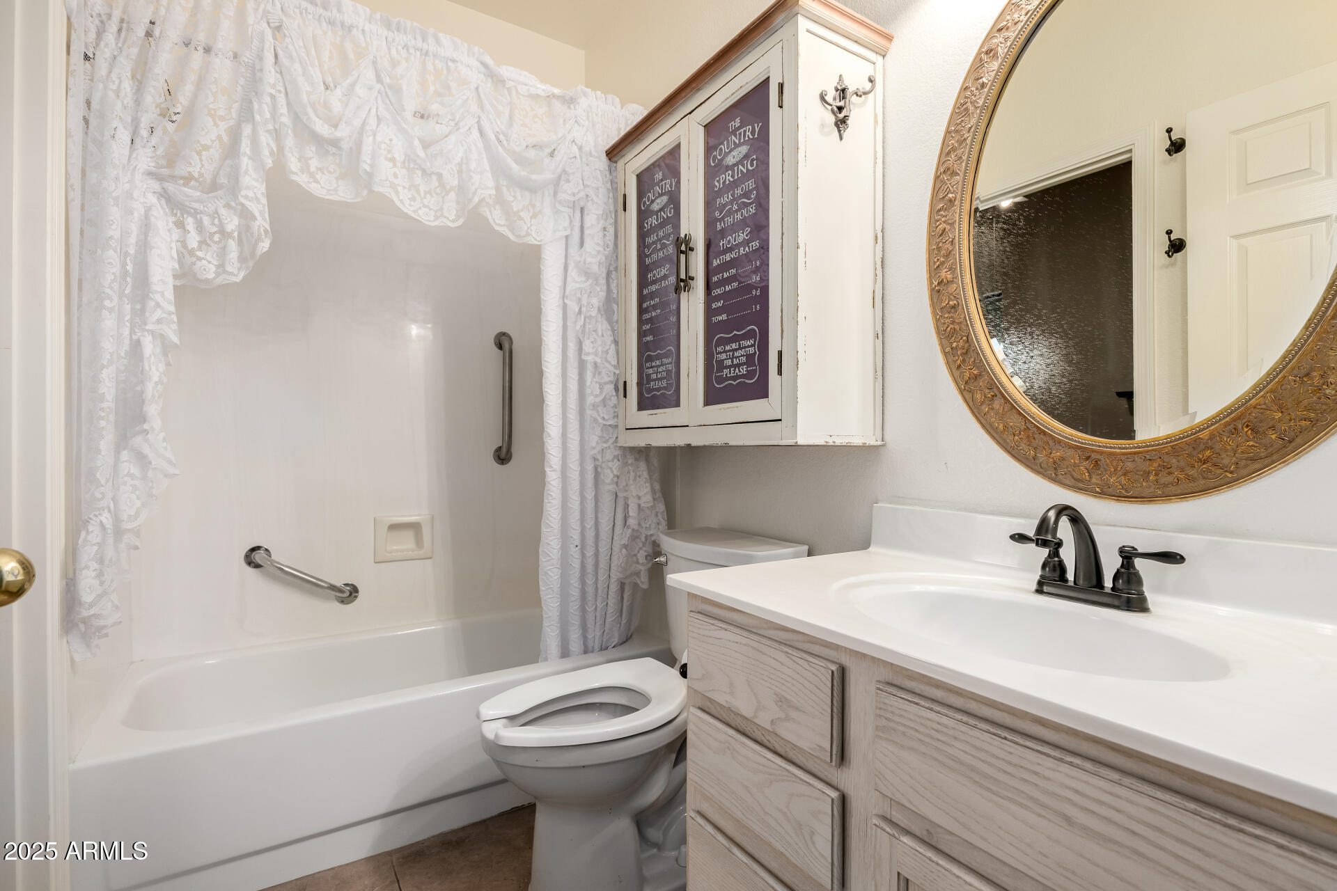 14841 South 46th Place Phoenix, AZ 85044 - Photo 31 of 43 a bathroom with a sink a toilet and a mirror