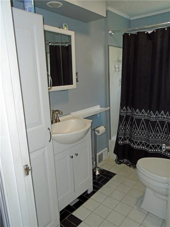 1001 7th Avenue Conway, PA 15027 - Photo 12 of 36 a bathroom with a sink toilet and shower