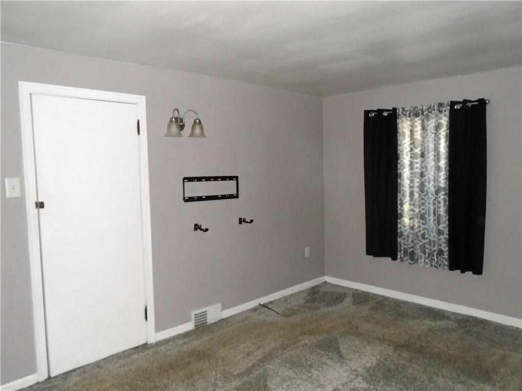 1001 7th Avenue Conway, PA 15027 - Photo 16 of 36 a view of an empty room with a window