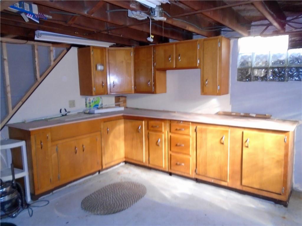 1001 7th Avenue Conway, PA 15027 - Photo 19 of 36 a view of a kitchen with wooden floor and a sink