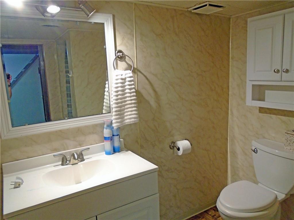 1001 7th Avenue Conway, PA 15027 - Photo 22 of 36 a bathroom with a sink a toilet and shower