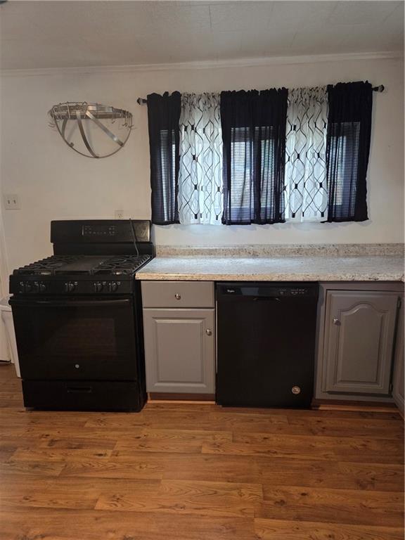 1001 7th Avenue Conway, PA 15027 - Photo 31 of 36 a kitchen with stainless steel appliances granite countertop a stove and a refrigerator