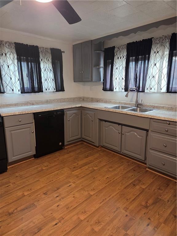 1001 7th Avenue Conway, PA 15027 - Photo 33 of 36 a kitchen with stainless steel appliances granite countertop a sink and cabinets with wooden floor