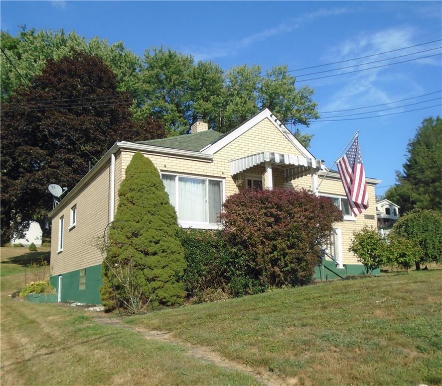 1001 7th Avenue Conway, PA 15027 - Photo 36 of 36 a front view of a house with a yard