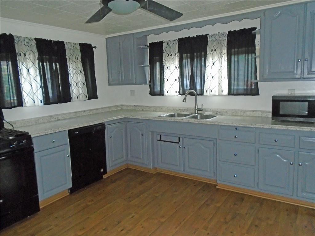 1001 7th Avenue Conway, PA 15027 - Photo 5 of 36 a spacious bathroom with a granite countertop sink and a mirror