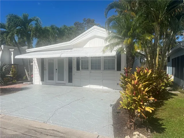a flower plants in front of a house