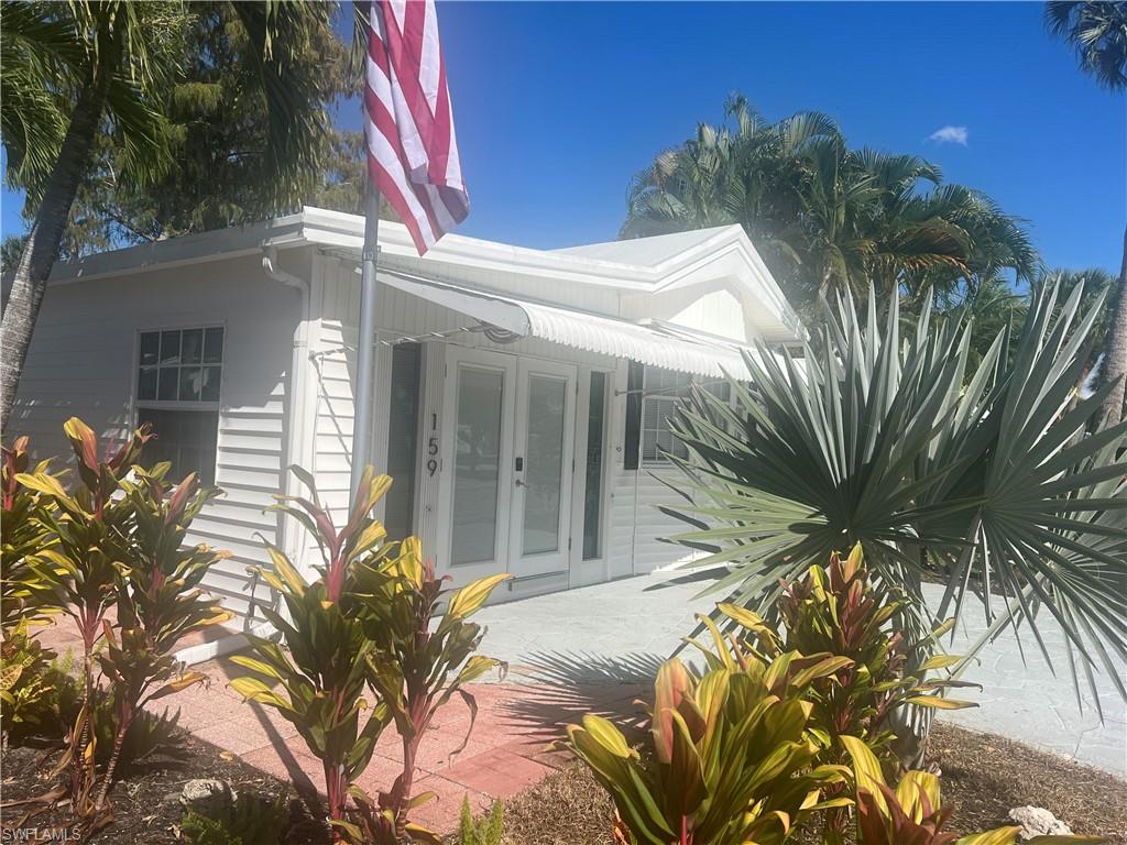 159 Cheetah Drive, Unit 159 Naples, FL 34114 - Photo 2 of 31 a view of a house with a patio