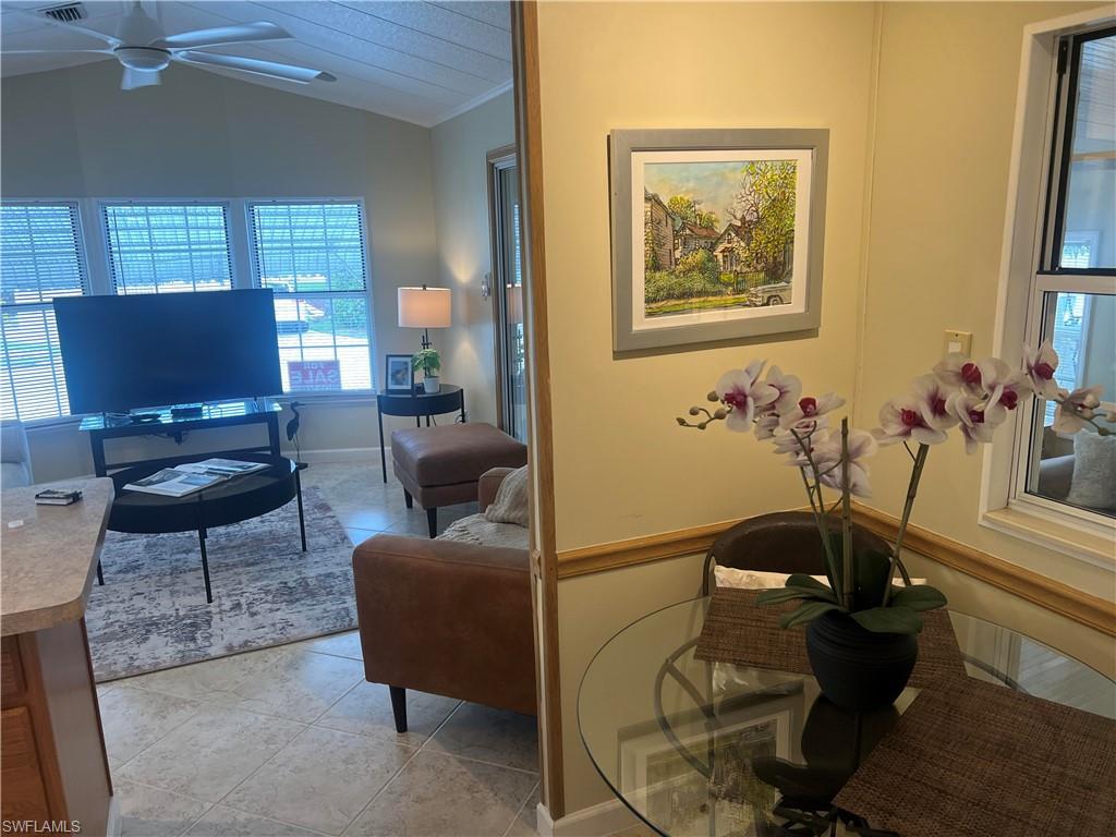 159 Cheetah Drive, Unit 159 Naples, FL 34114 - Photo 21 of 31 a living room with furniture and a potted plant