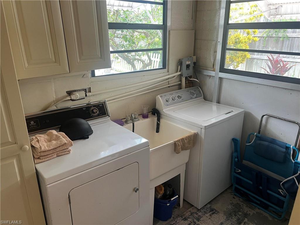 159 Cheetah Drive, Unit 159 Naples, FL 34114 - Photo 24 of 31 a utility room with dryer and washer