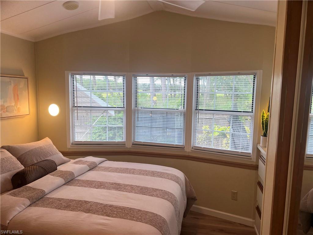 159 Cheetah Drive, Unit 159 Naples, FL 34114 - Photo 27 of 31 a bedroom with a bed and a window