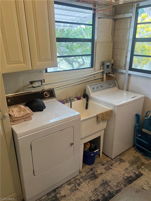 159 Cheetah Drive, Unit 159 Naples, FL 34114 - Photo 31 of 31 a utility room with dryer and washer