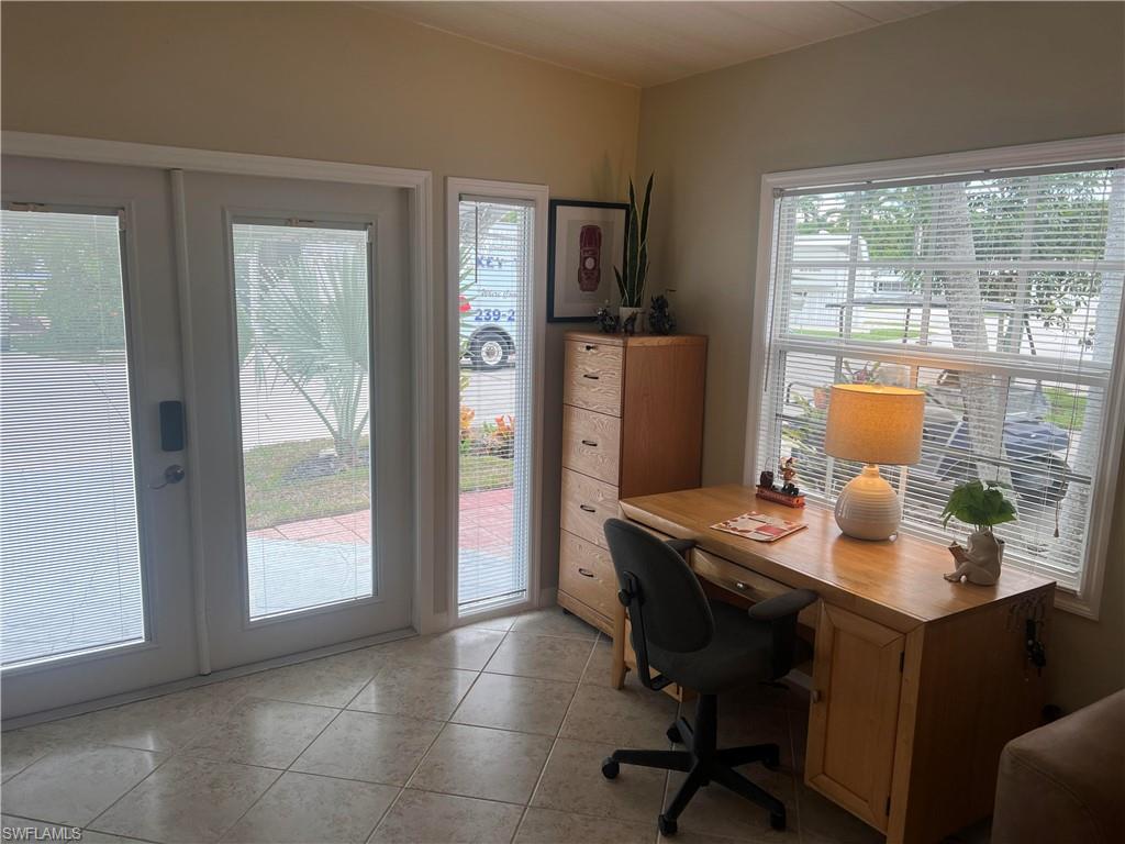 159 Cheetah Drive, Unit 159 Naples, FL 34114 - Photo 5 of 31 a workspace with furniture and window