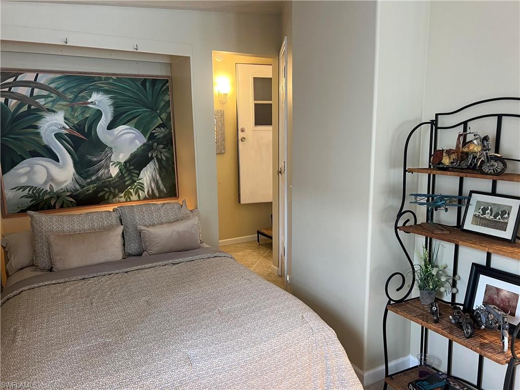 159 Cheetah Drive, Unit 159 Naples, FL 34114 - Photo 9 of 31 a bedroom with a bed and a window