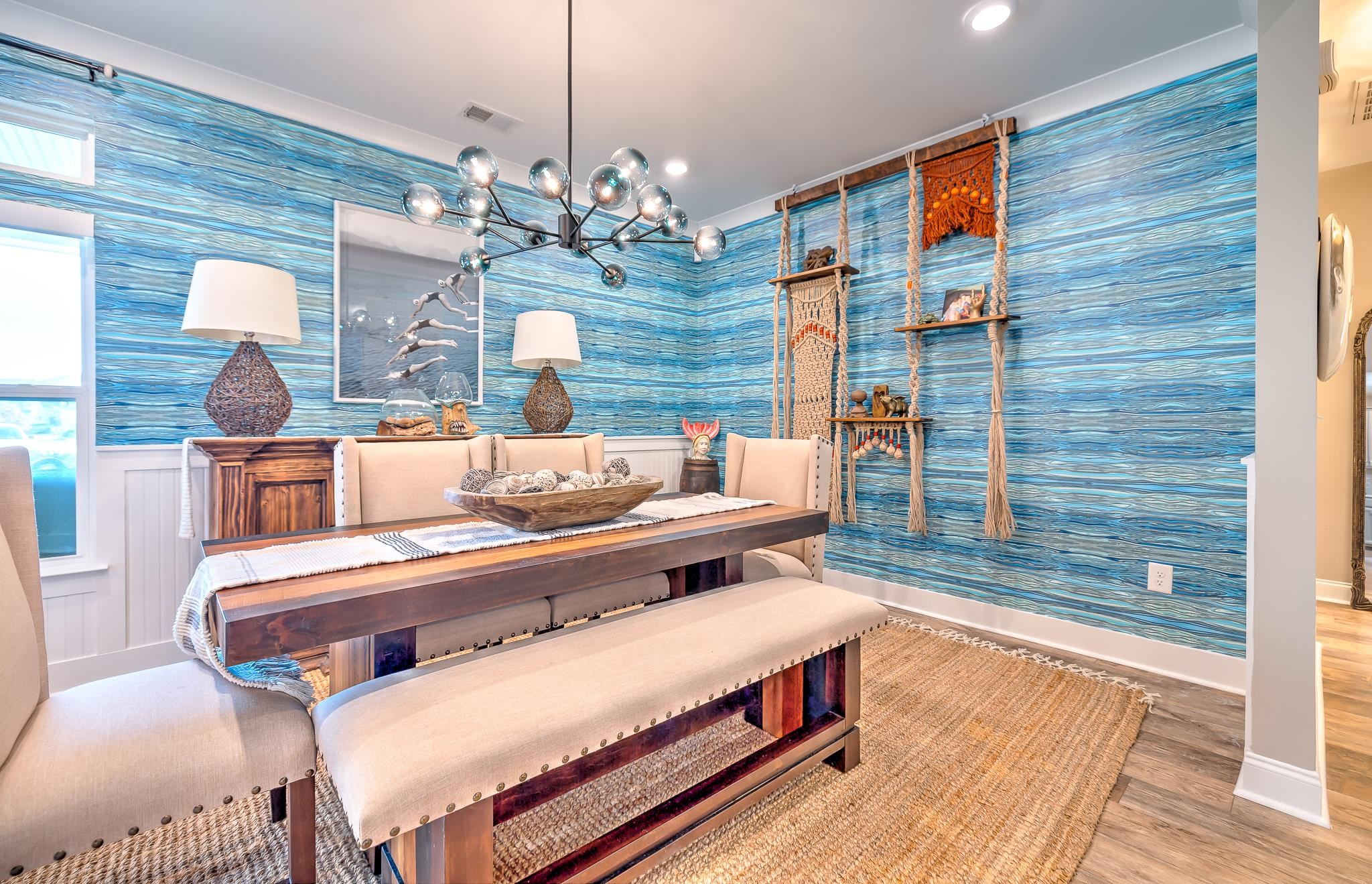 2488 Goldfinch Drive Myrtle Beach, SC 29577 - Photo 13 of 38 Dining space featuring wallpapered walls, wood finished floors, a chandelier, and a wainscoted wall