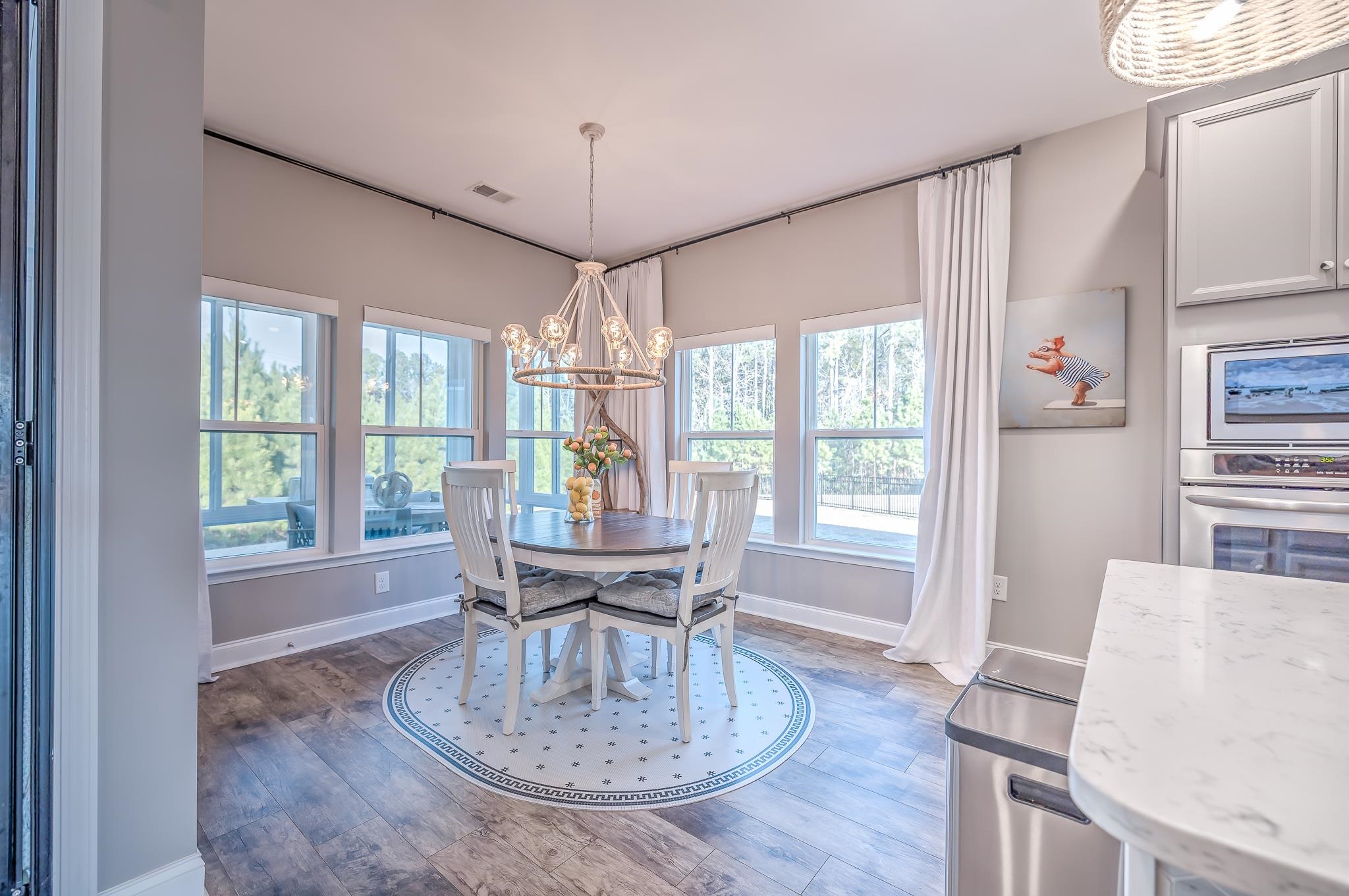 2488 Goldfinch Drive Myrtle Beach, SC 29577 - Photo 16 of 38 Dining room featuring light wood-type flooring and a chandelier
