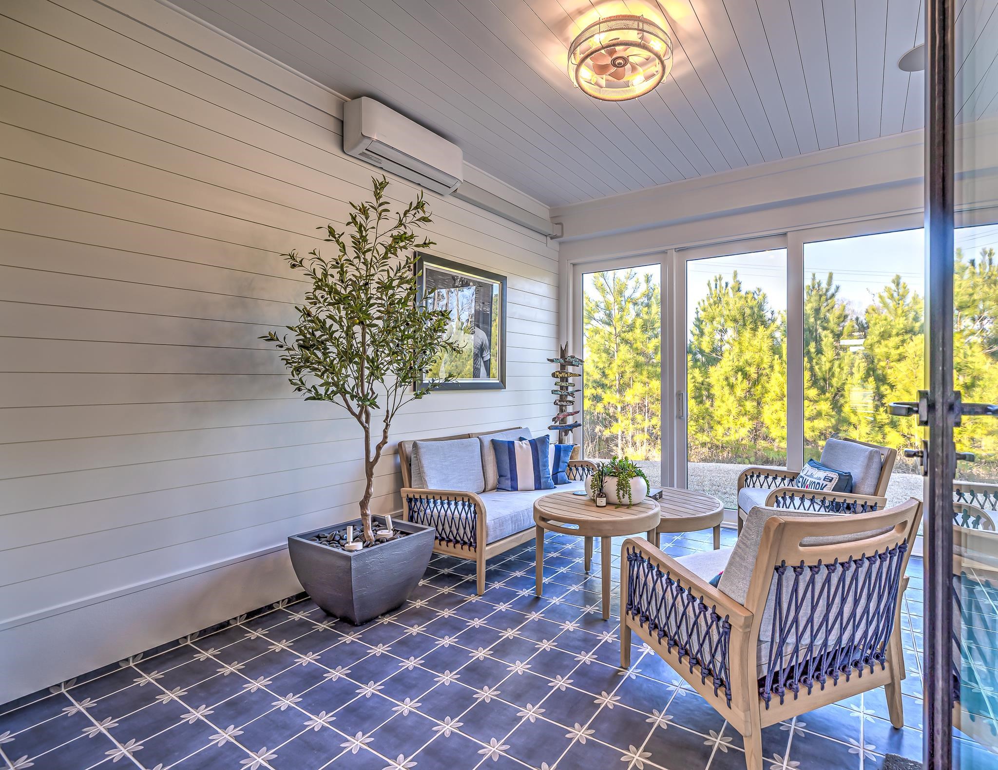 2488 Goldfinch Drive Myrtle Beach, SC 29577 - Photo 19 of 38 Sunroom / solarium featuring a wall mounted AC, wood ceiling, and wood walls