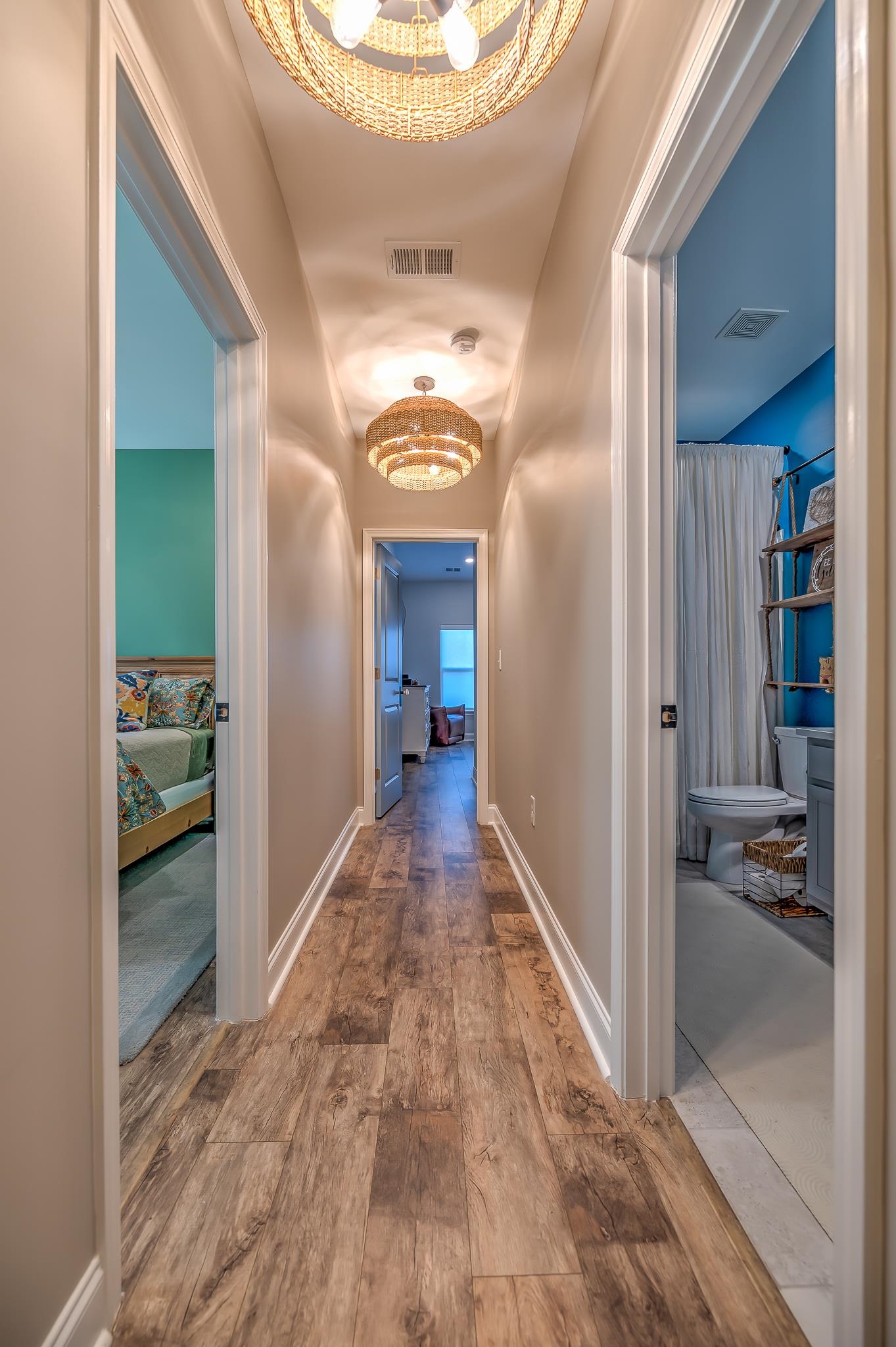 2488 Goldfinch Drive Myrtle Beach, SC 29577 - Photo 22 of 38 Hall featuring hardwood / wood-style flooring and a chandelier