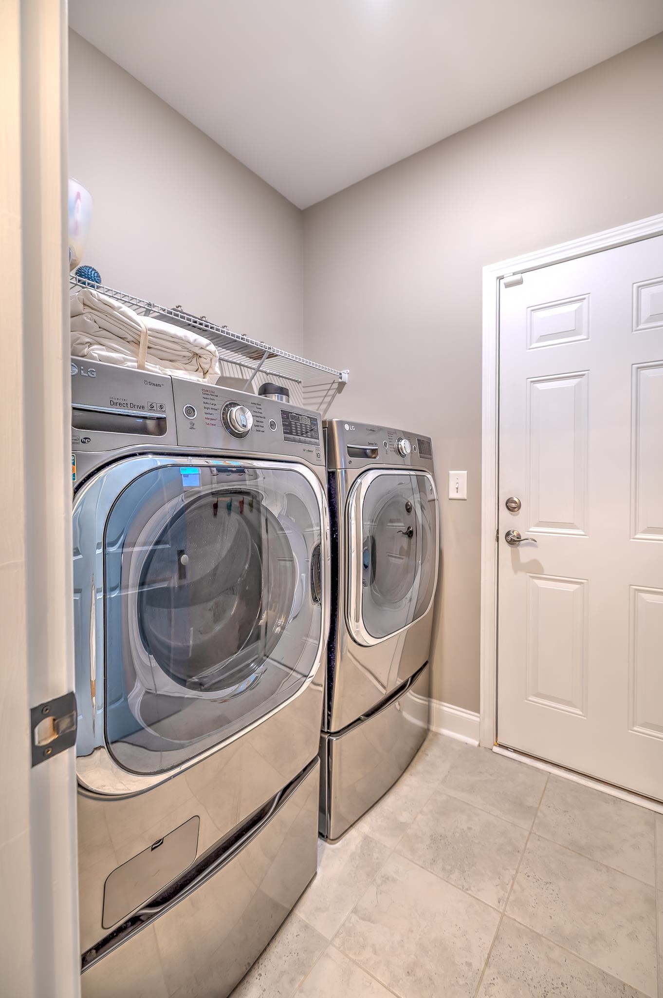 2488 Goldfinch Drive Myrtle Beach, SC 29577 - Photo 23 of 38 Laundry room with washing machine and clothes dryer and baseboards